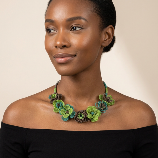 Tinkers handcrafted beaded floral collar necklace with iridescent lime green, teal, and bronze rose blooms.