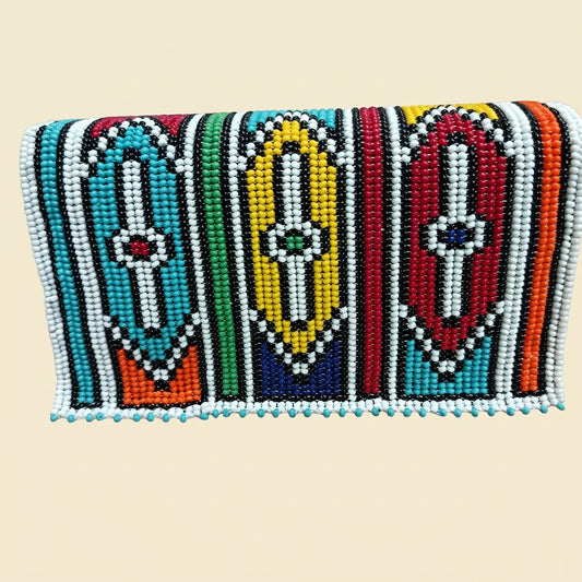 Ndebele Doll Figure Beaded Clutch on cream background