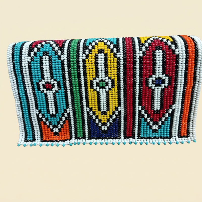 Ndebele Doll Figure Beaded Clutch on cream background