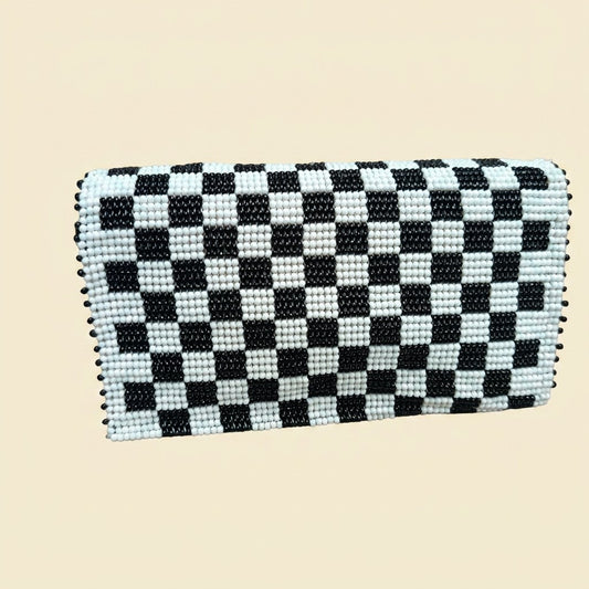 Black and White Checkerboard Beaded Clutch on cream background