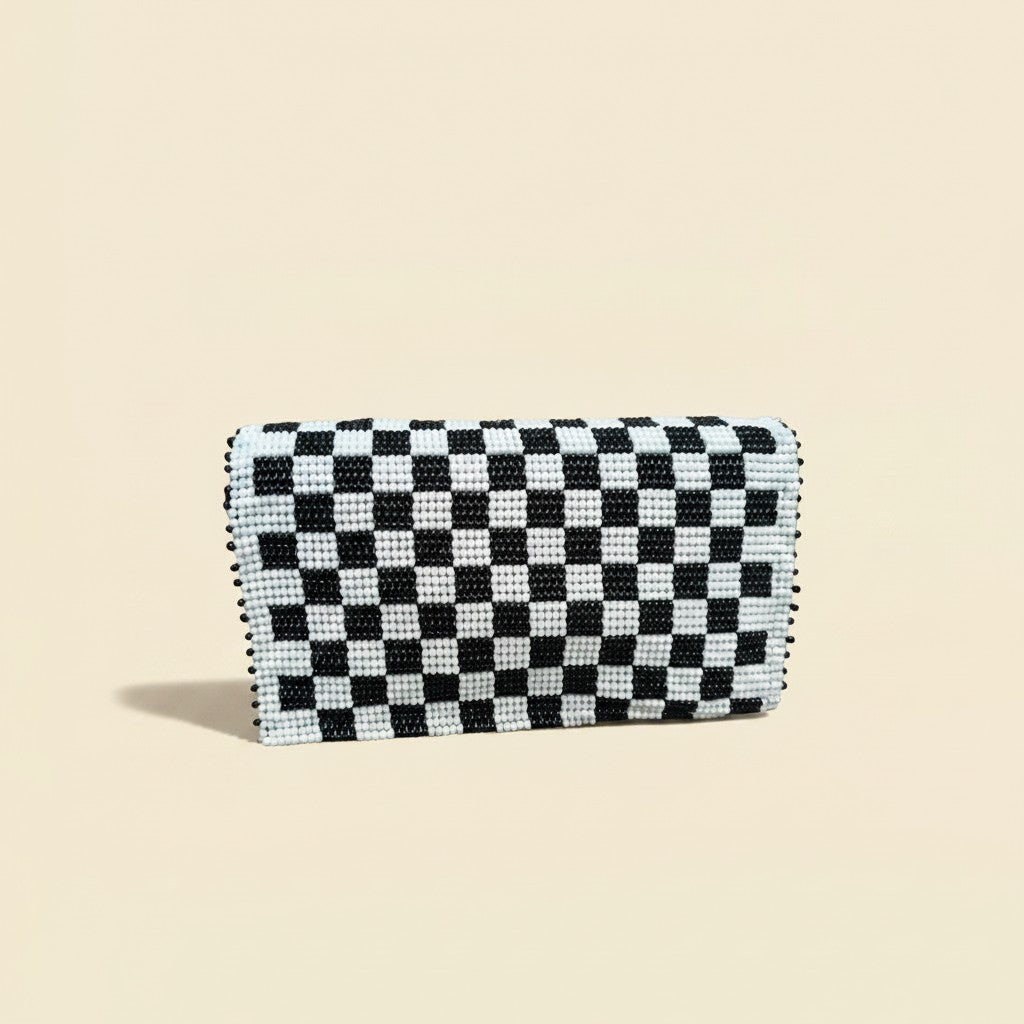 Tinkers black and white checkerboard beaded clutch with a structured rectangular shape and hand-beaded glass finish.