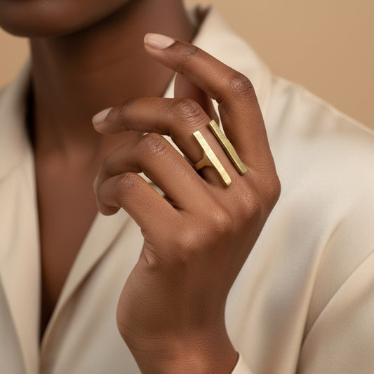 Tinkers architectural brass ring featuring two parallel vertical bars on a model with a matte brushed finish.
