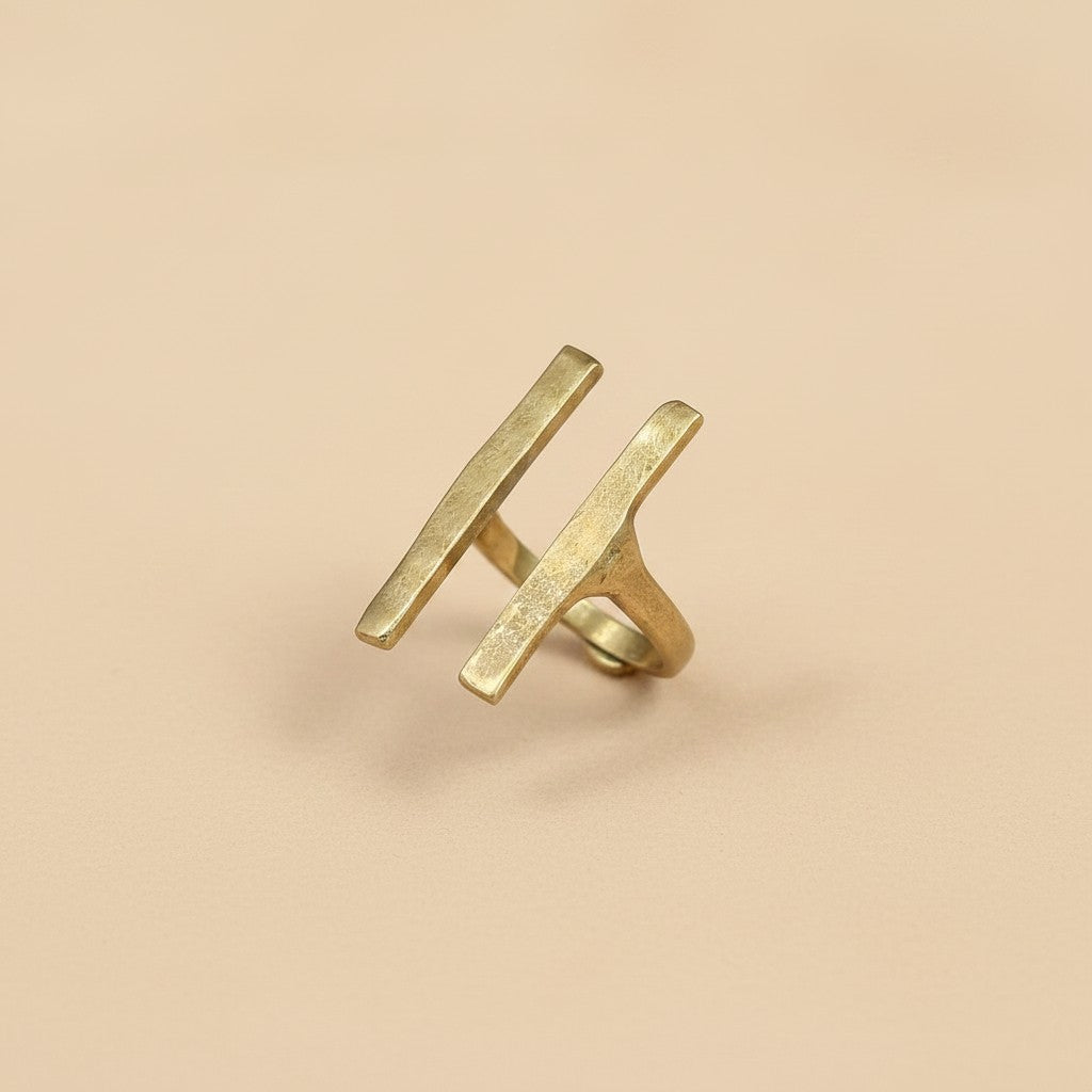 Tinkers architectural brass ring featuring two raised parallel bars with a matte brushed finish on a neutral background.