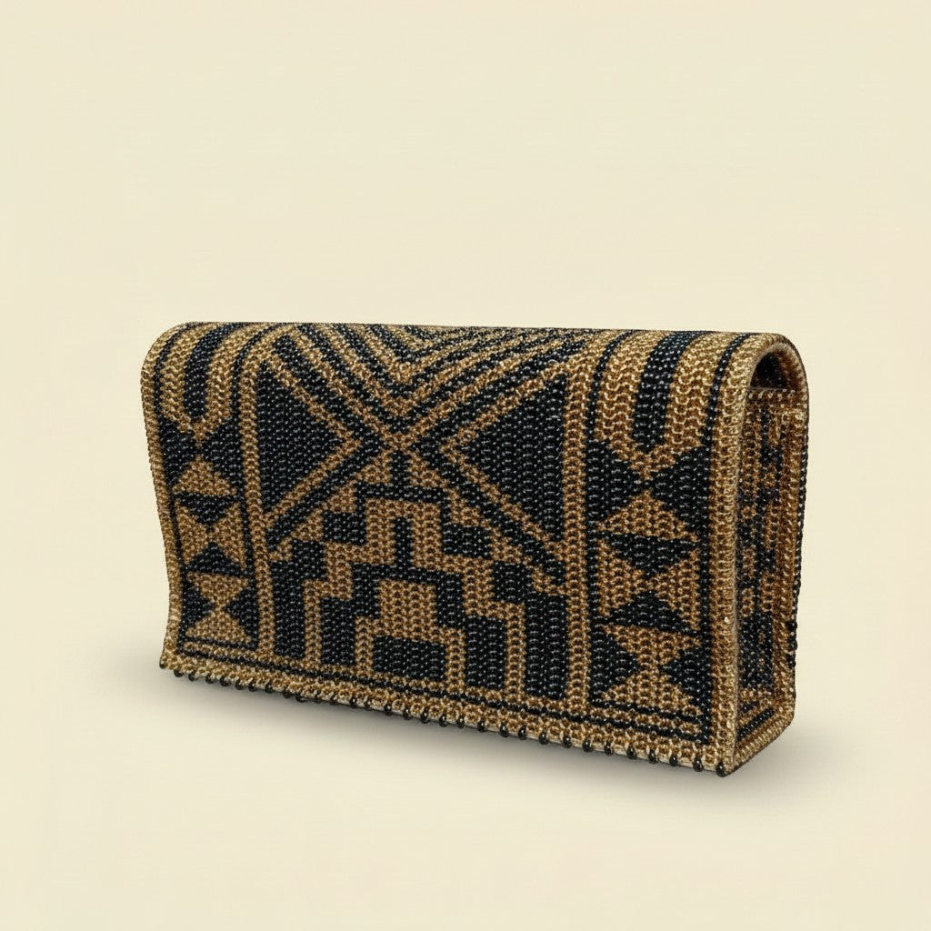 Tinkers handcrafted leopard print clutch with metallic gold and black seed beads in a structured arched silhouette.